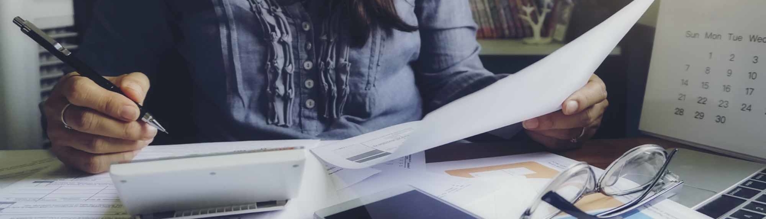 woman looking over financial information